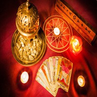 Tarot cards illuminated by candlelight.