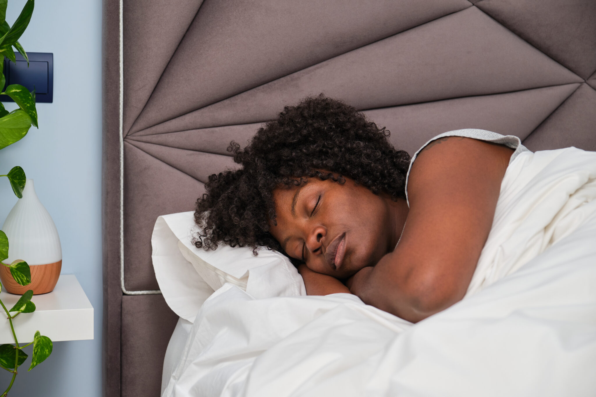 african young woman sleeping on white sheets in be 2023 11 27 04 56 38 utc 1 scaled