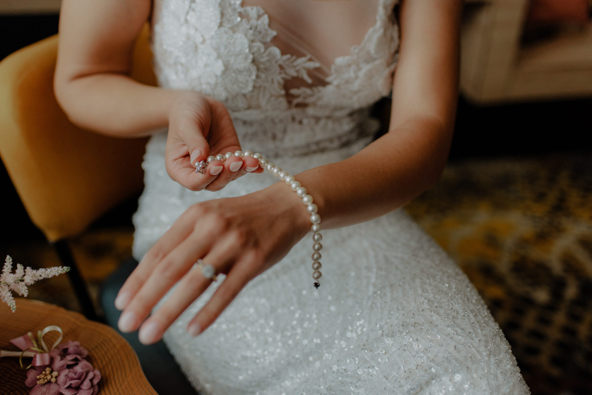 bride wearing a pearl bracelet on her wrist 2023 11 27 05 28 01 utc scaled