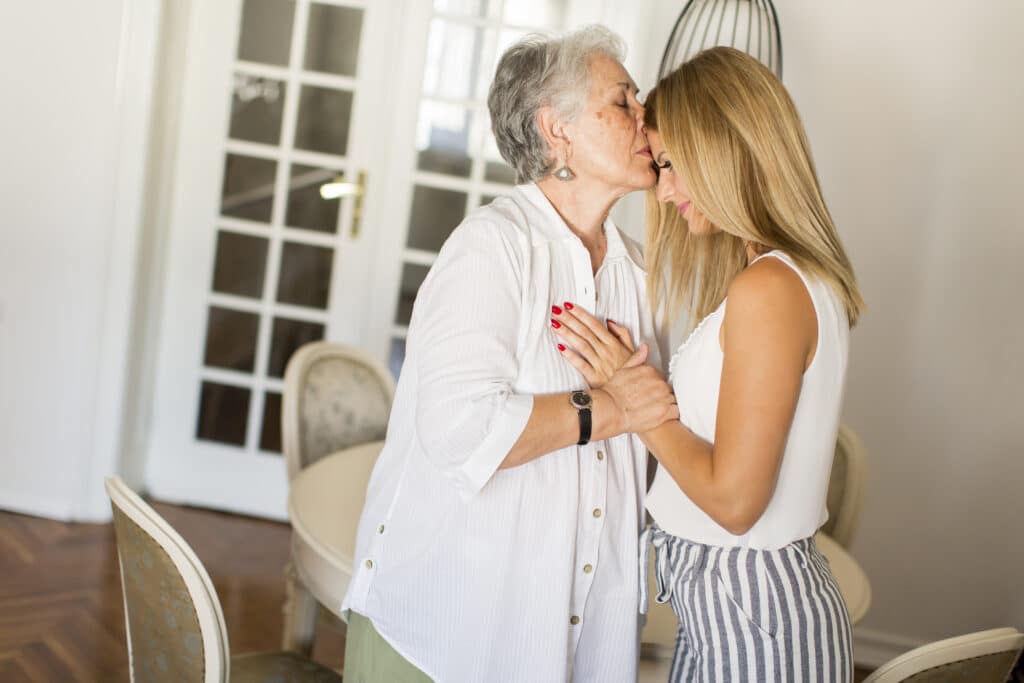 grandmother kissing granddaughter 2023 11 27 05 31 37 utc